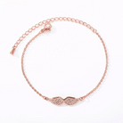 Rose gold angel wing bracelet, flat lay close-up