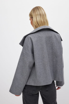 Grey double-breasted cropped coat, back view on model