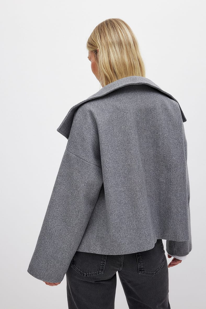 Grey double-breasted cropped coat, back view on model