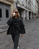 Charcoal short cape, full-length front view on model walking