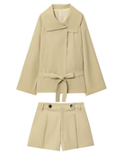 Flat lay of beige belted trench jacket and matching shorts set