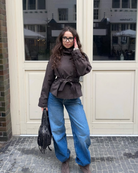 Brown short trench coat with belted waist, full length front view