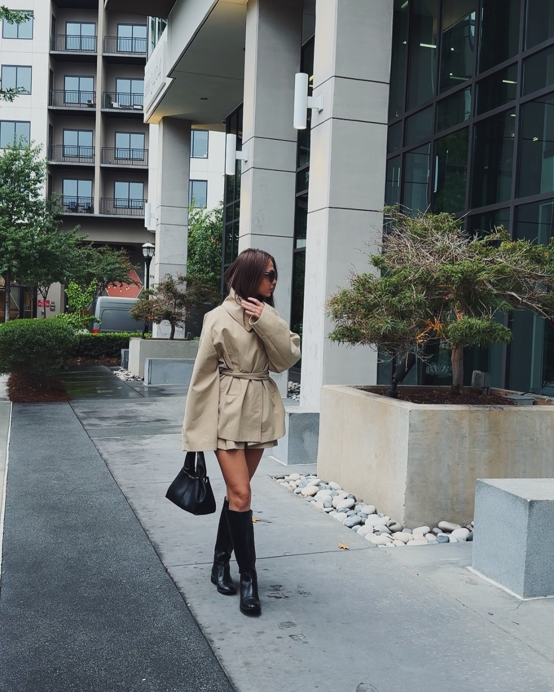 Beige trench jacket and shorts set, side view on model outdoors