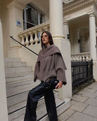 Taupe short cape with draped cowl neck, front view on model