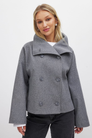 Grey double-breasted cropped coat, front view on model
