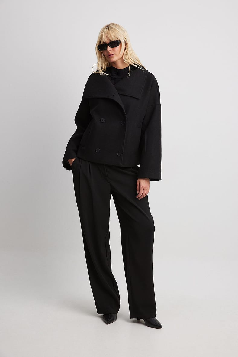 Black double-breasted cropped coat, full-length front view
