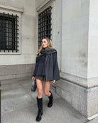 Charcoal short cape with wrapped scarf detail, front view on model
