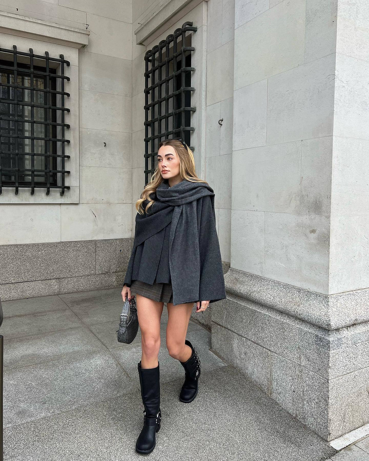 Charcoal short cape with wrapped scarf detail, front view on model