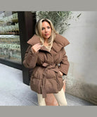 Brown belted puffer jacket, front view on model, street style