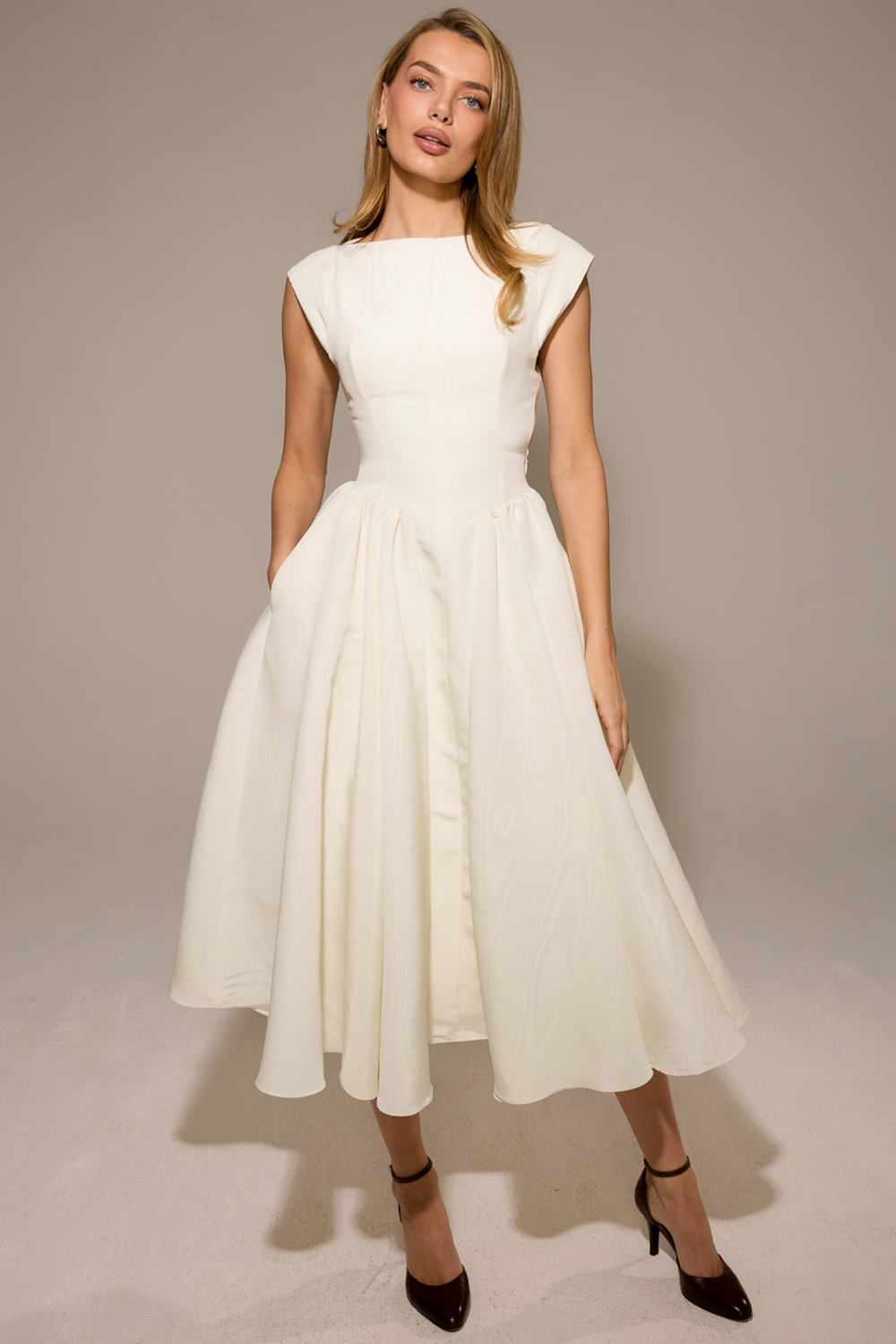 Ivory full-skirt midi dress with boat neckline, front view on model