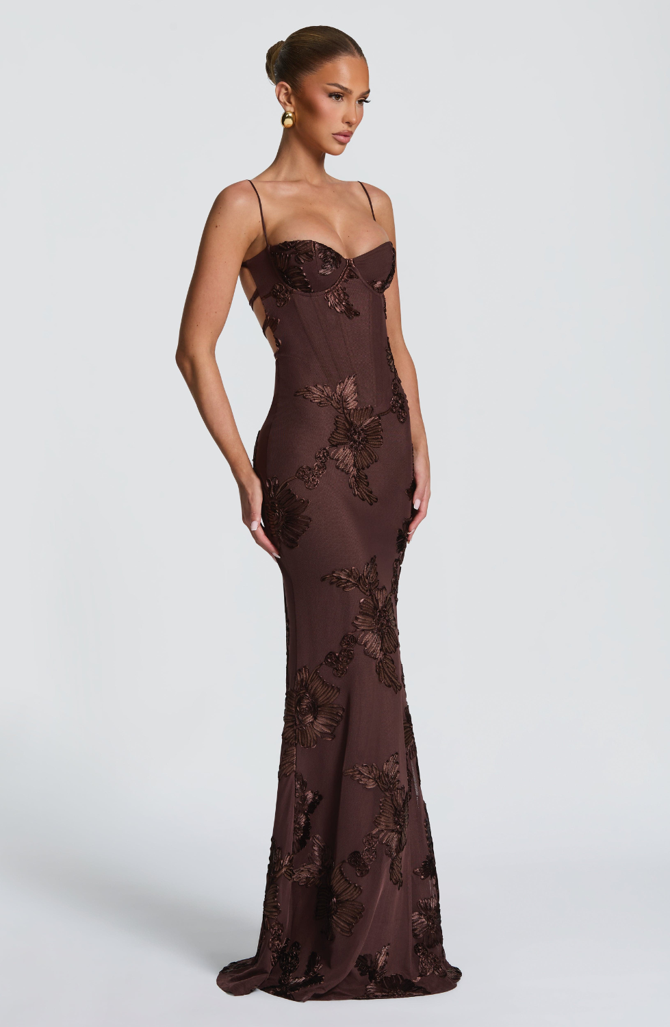 Mocha brown fitted maxi dress with floral lace embroidery, alternate side view on model