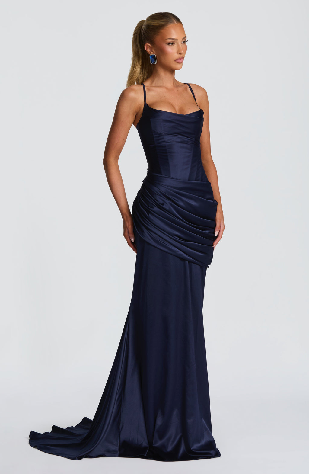 Navy satin gown with ruched skirt, side view on model