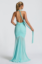 Back view of aqua mesh halter maxi dress with tie streamer