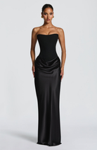 Black strapless satin maxi dress with draped skirt, front view on model