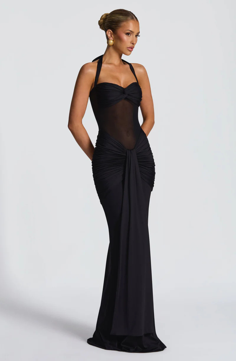 Black halter neck maxi dress, side view on model