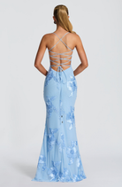 Baby blue fitted maxi dress with lace-up open back, back view on model