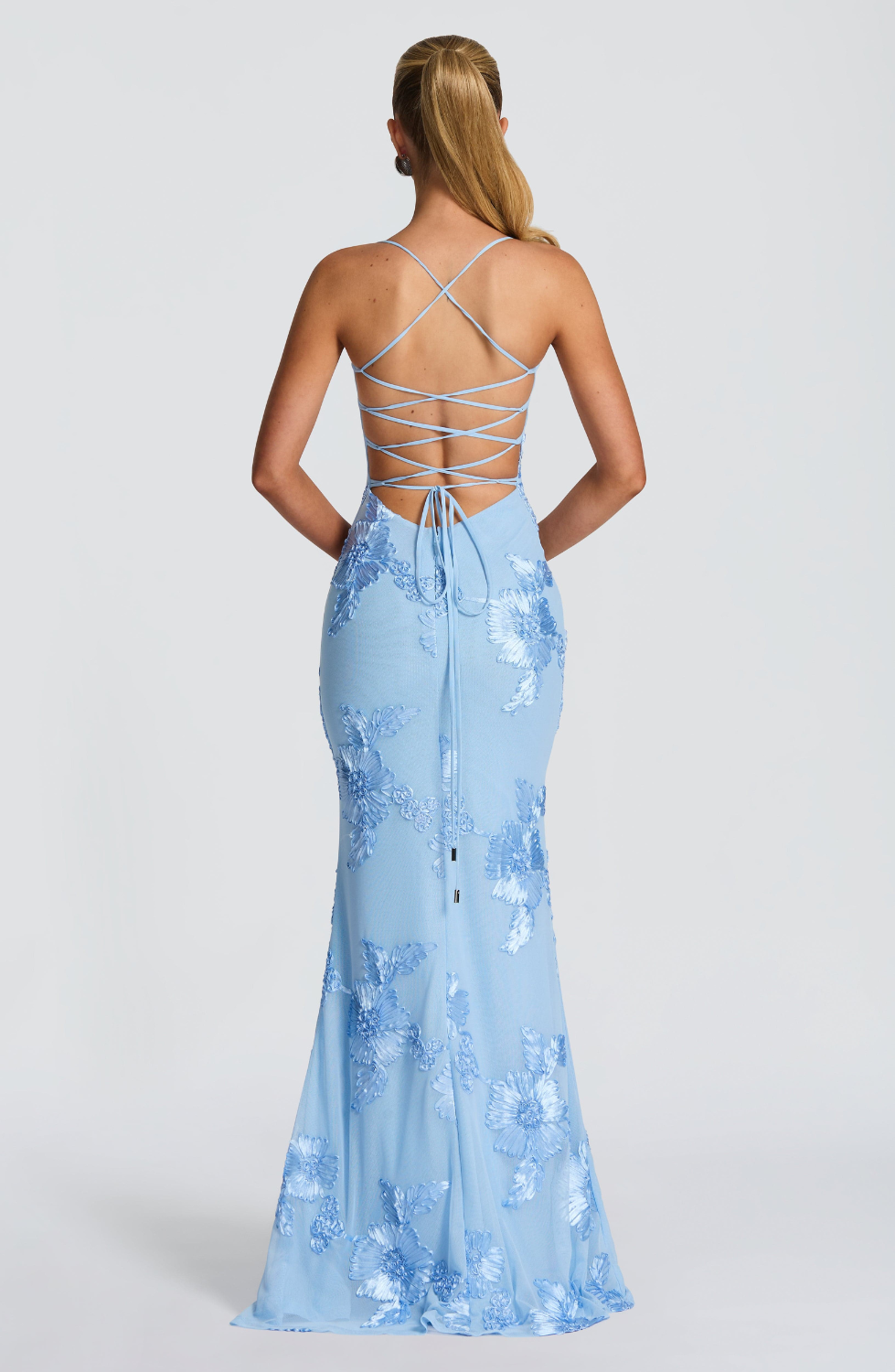 Baby blue fitted maxi dress with lace-up open back, back view on model
