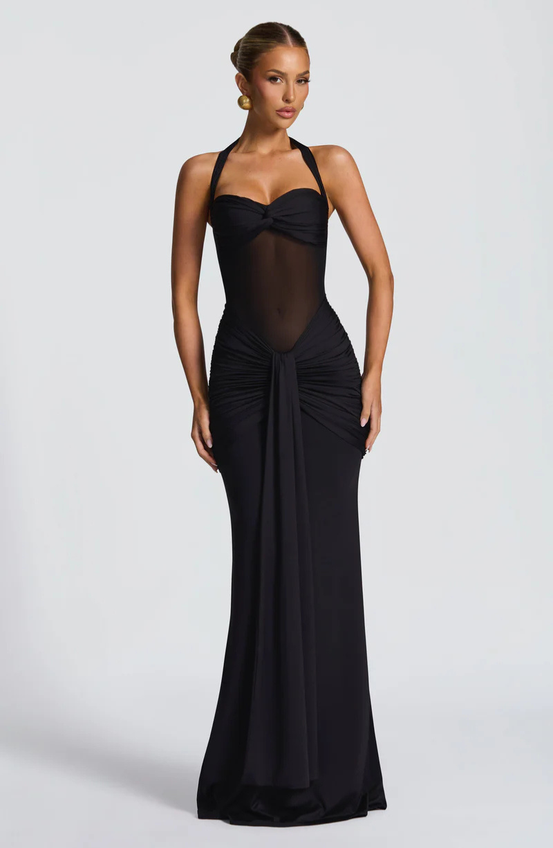 Black halter neck maxi dress with ruched skirt, front view on model