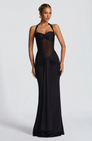 Black halter neck maxi dress with ruched skirt, front view on model