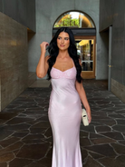Pink satin slip maxi dress, model walking through archway