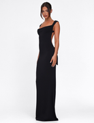 Black maxi dress with side bow cutout, side view on model