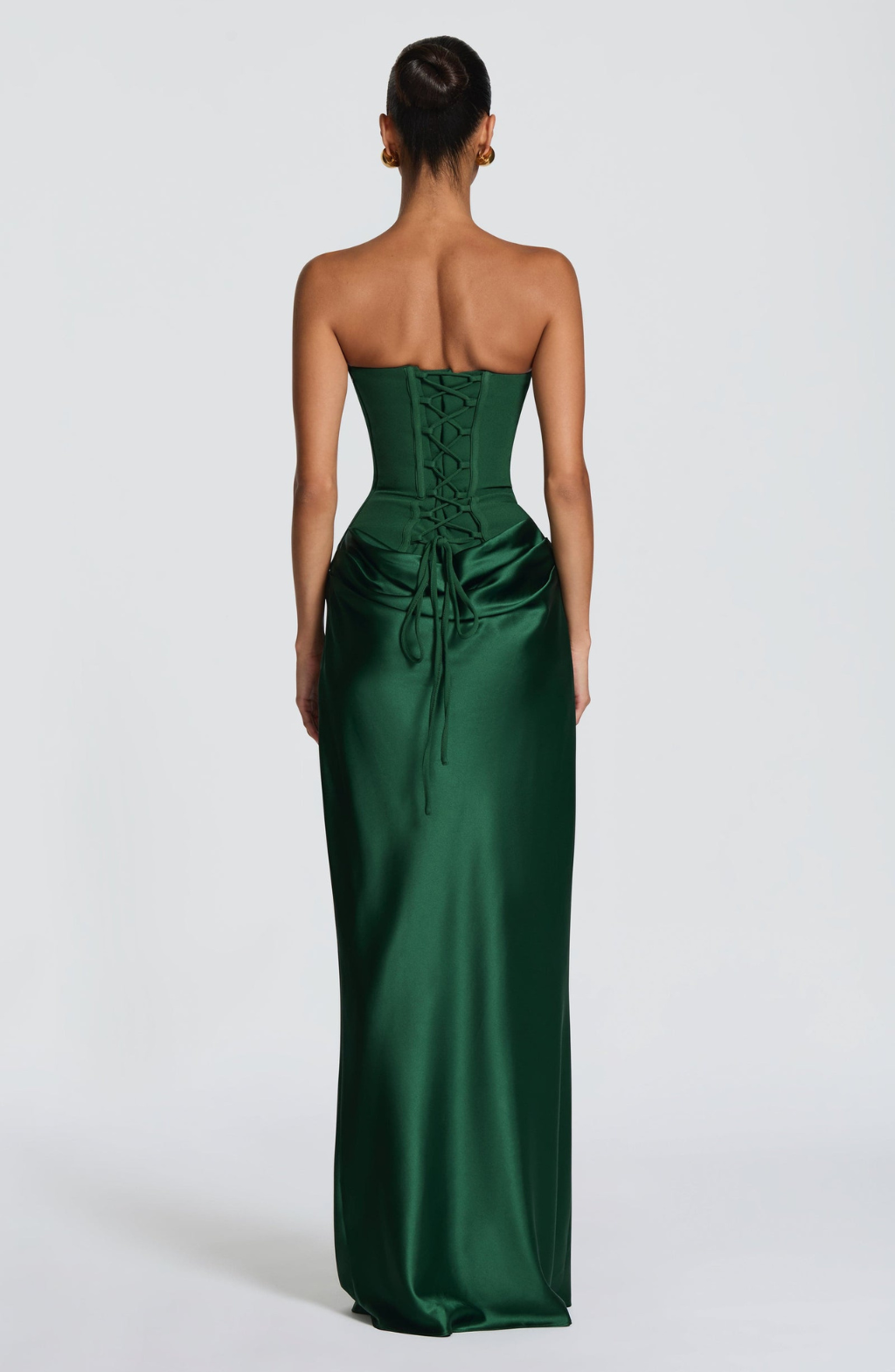 Back view of emerald green satin maxi dress showing lace-up corset back