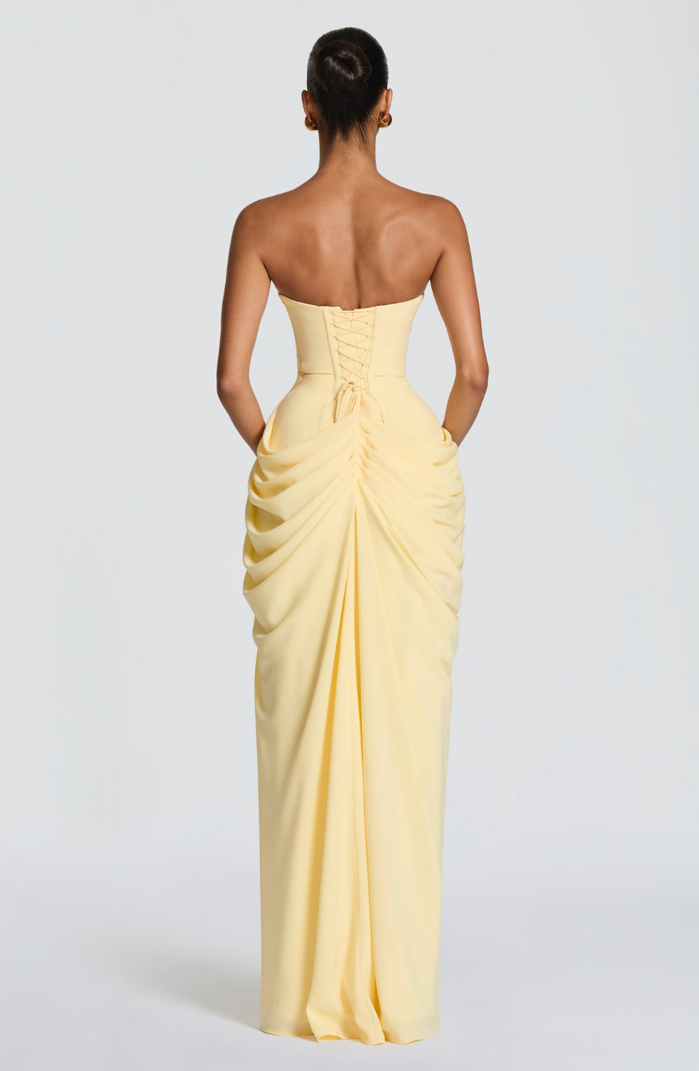 Lemon strapless maxi dress with corset lace-up back, back view on model