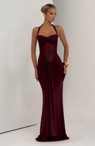 Wine halter neck maxi dress, three-quarter view on model