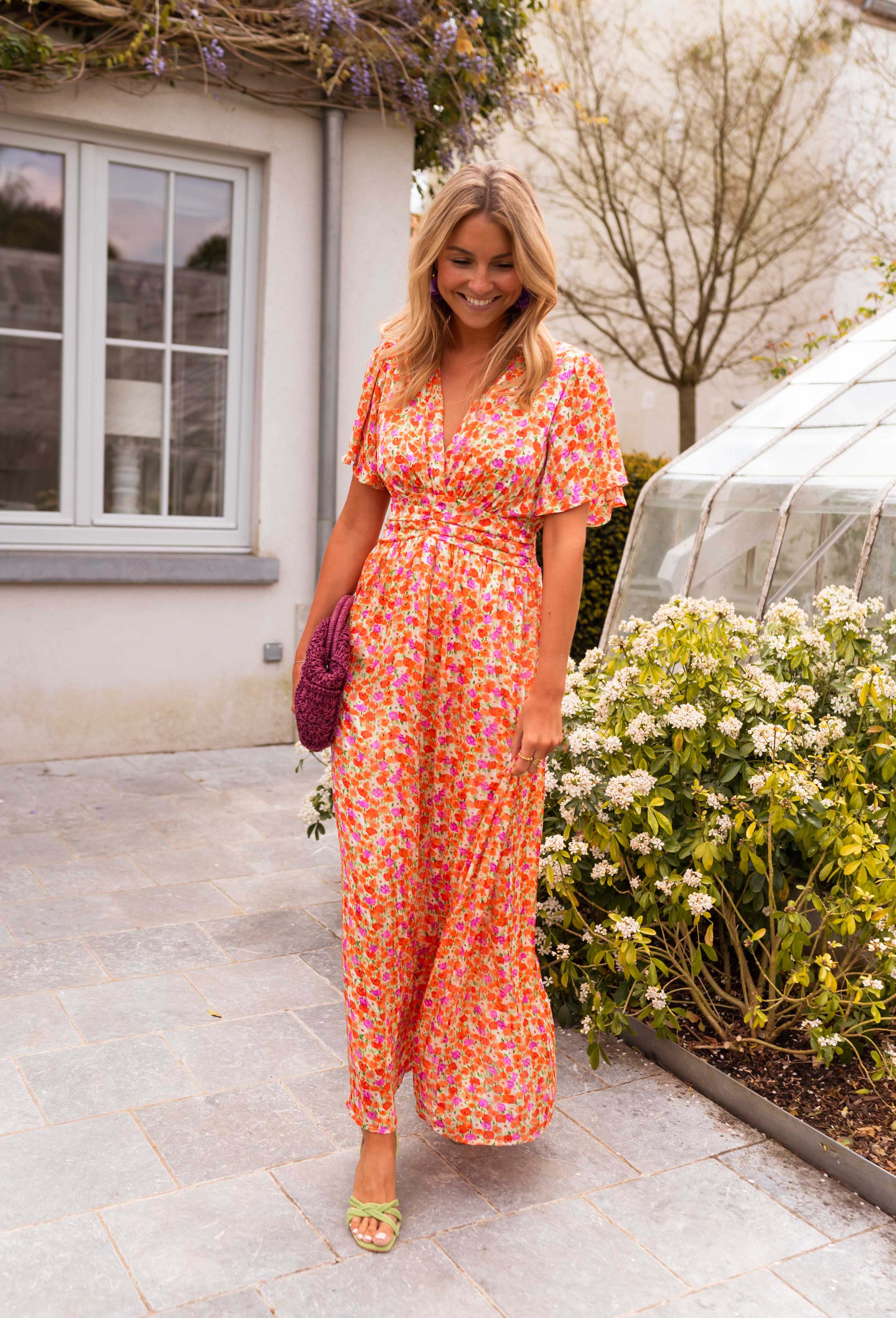 Orange floral print maxi dress, full length front view on model