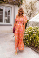 Orange floral print maxi dress, full length front view on model