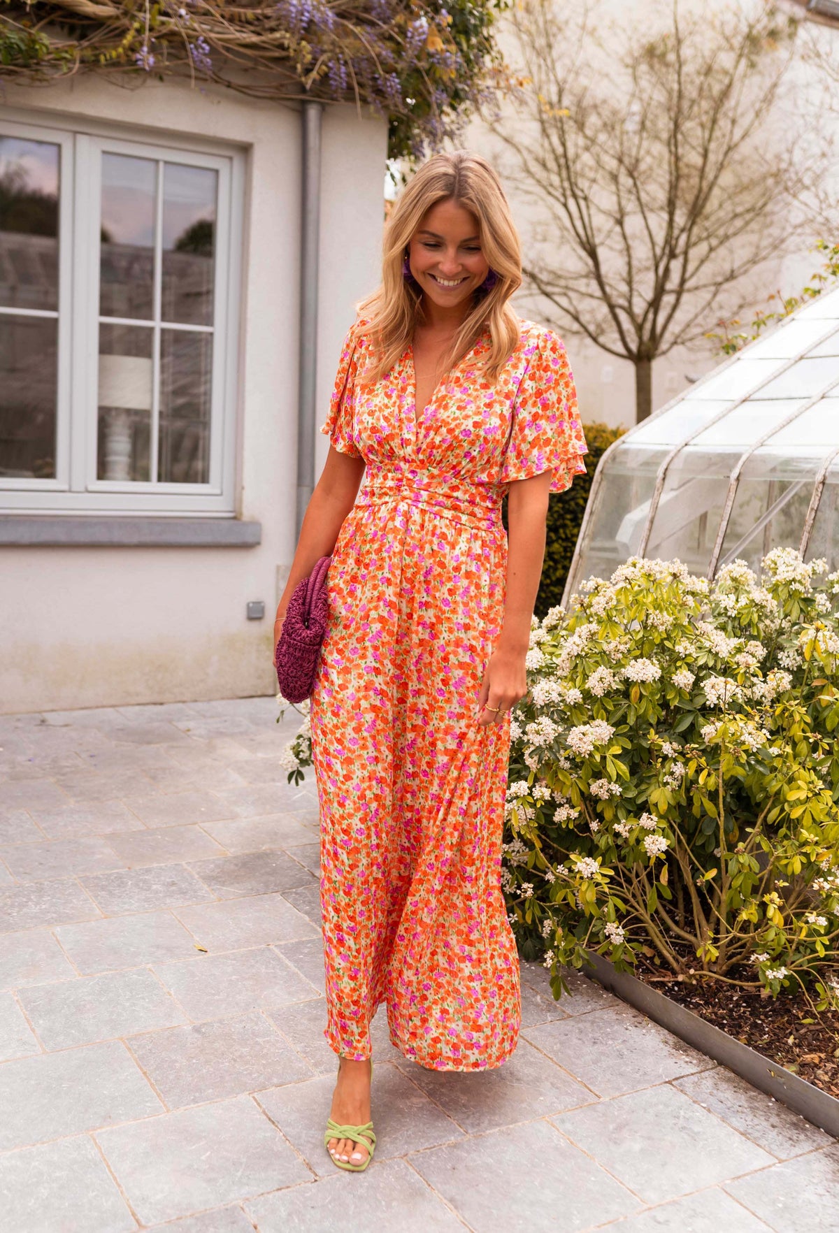 Orange floral print maxi dress, full length front view on model