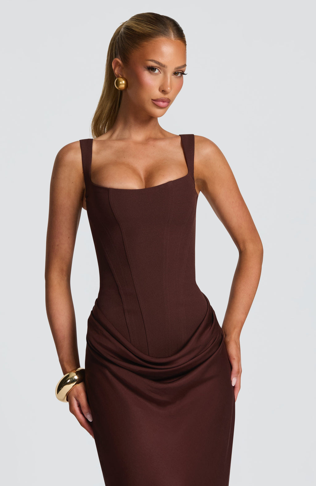 Close-up of mocha corset dress square neckline on model