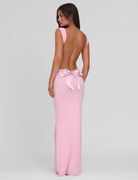 Baby pink maxi dress with open back and bow detail, back view on model