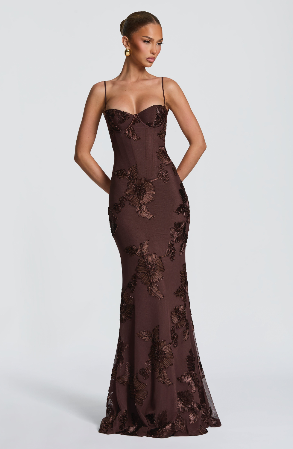 Mocha brown fitted maxi dress with floral lace embroidery, side view on model