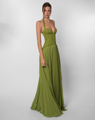 Olive green lace corset maxi dress with pleated skirt, three-quarter view on model