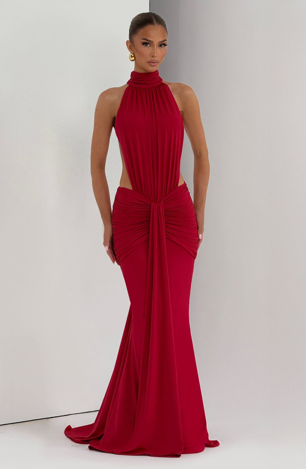 Red halter maxi dress with cutout waist, straight-on front view