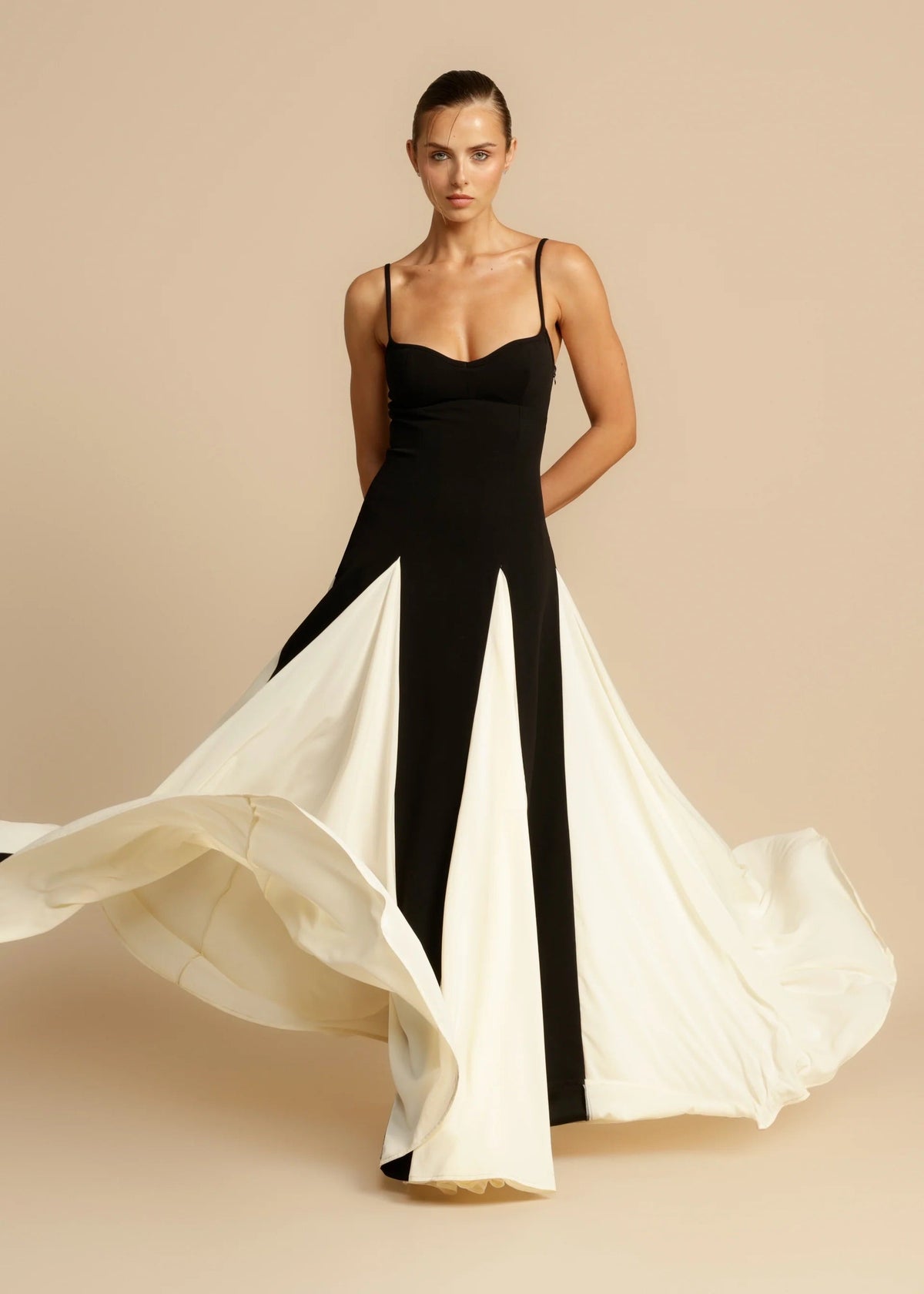 Black maxi dress with ivory panelled skirt, front view on model