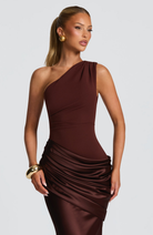 Close-up of mocha satin ruched waist on one-shoulder dress
