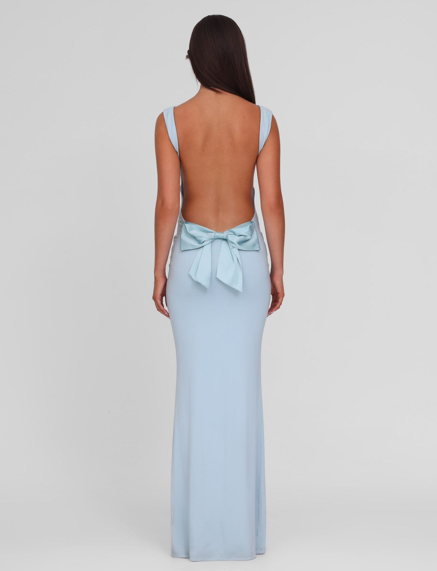 Baby blue maxi dress with open back and bow detail, back view on model