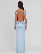 Baby blue maxi dress with open back and bow detail, back view on model