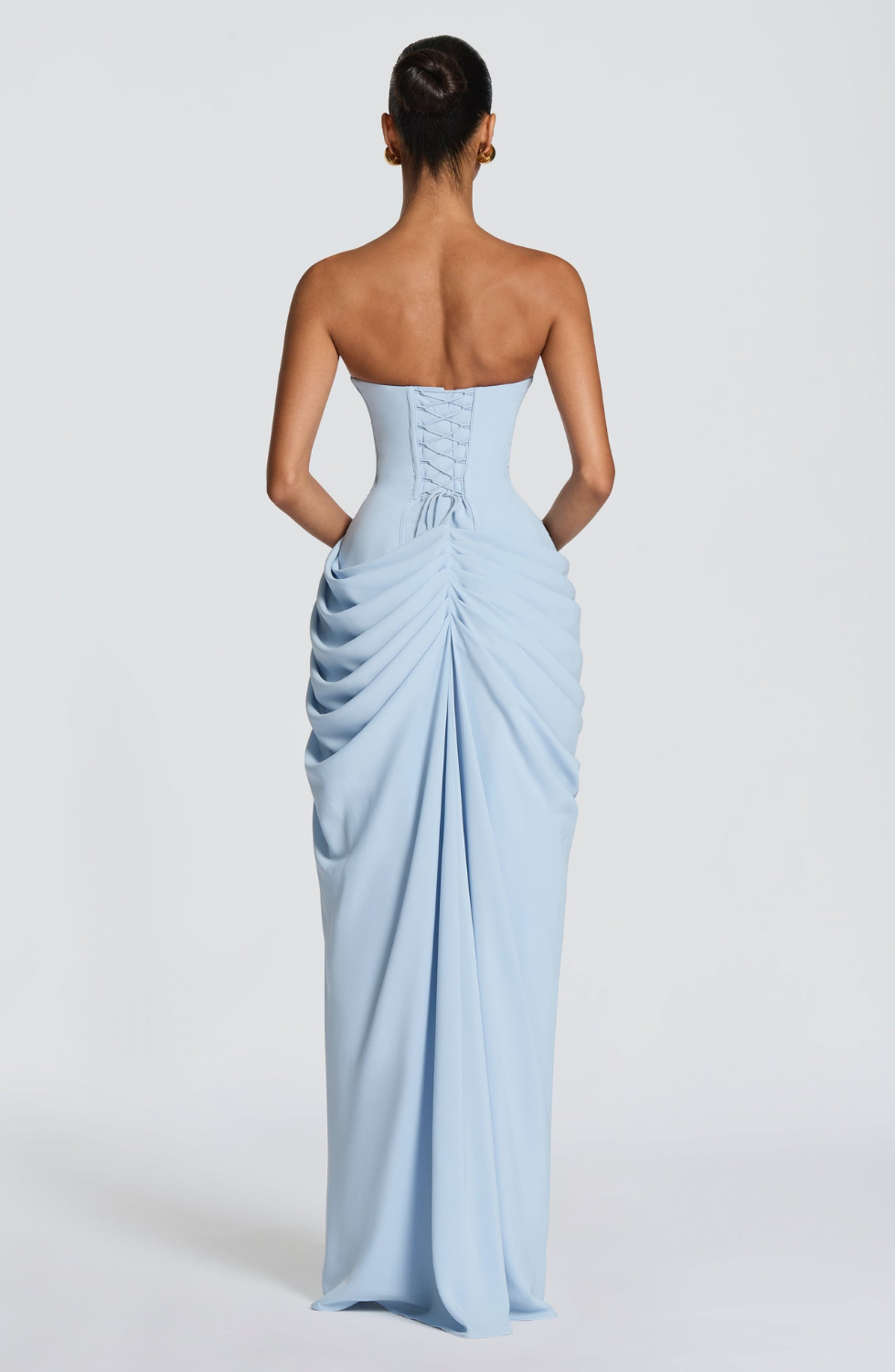 Ice blue strapless maxi dress with corset lace-up back, back view on model