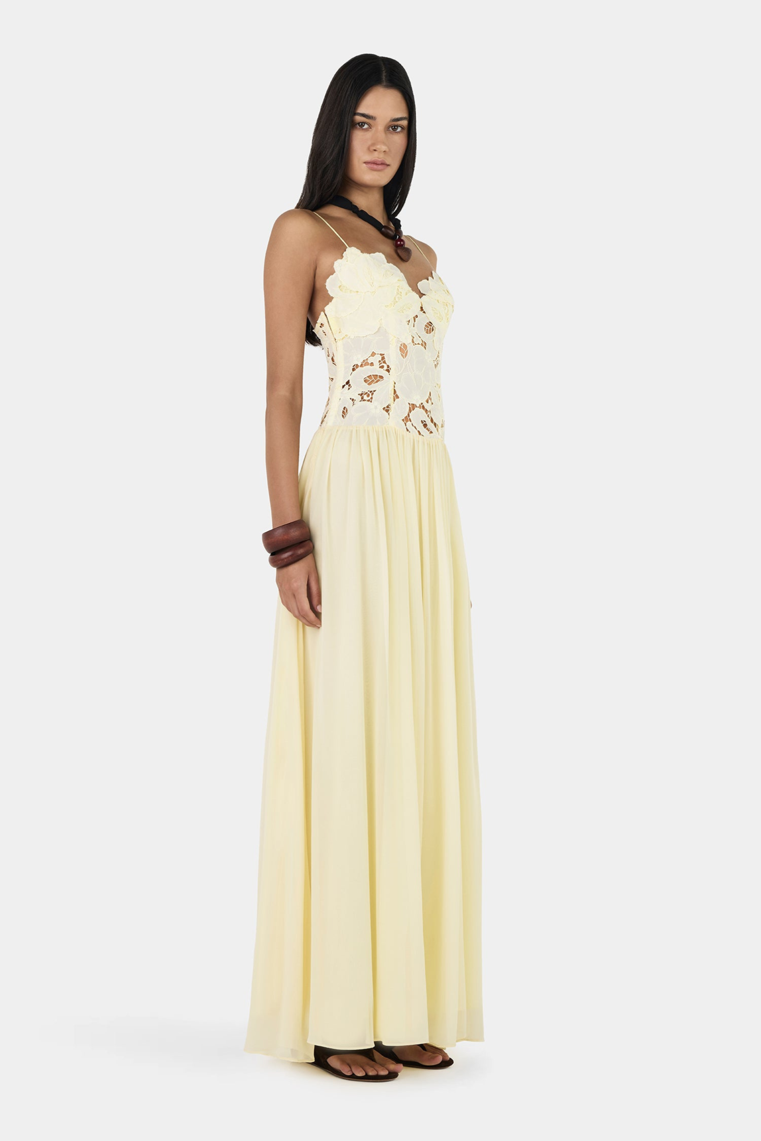 Butter lace maxi dress with floral bodice, side view on model