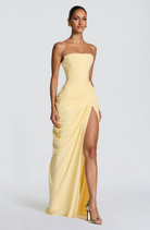 Lemon strapless maxi dress with thigh-high split, side view on model