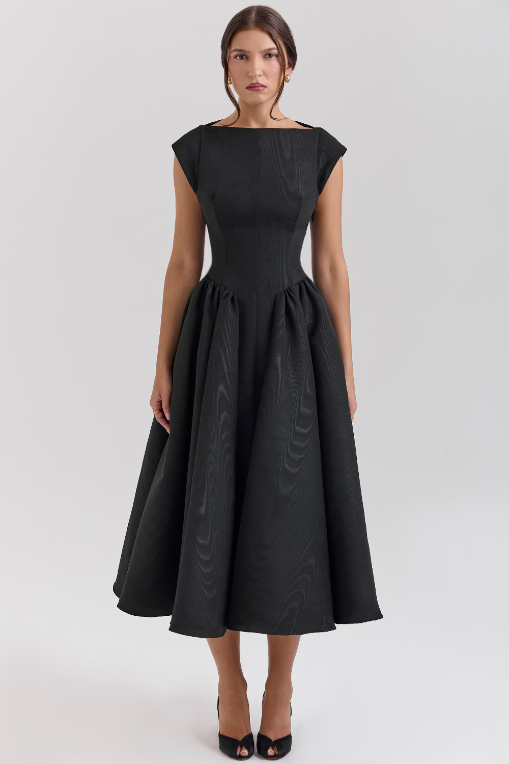 Black full-skirt midi dress with boat neckline, front view on model