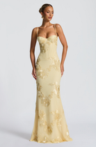 Lemon fitted maxi dress with corset bodice, close front view on model