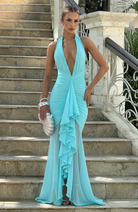 Aqua mesh halter maxi dress, lifestyle shot on outdoor steps