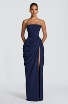 Navy strapless maxi dress with draped skirt, close front view on model