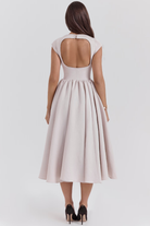French dove grey full-skirt midi dress, back view showing cutout detail