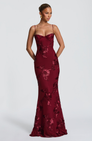 Burgundy fitted maxi dress with floral lace embroidery, front view on model