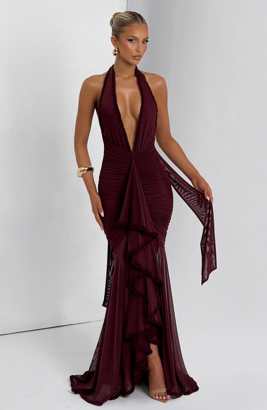 Cherry red mesh halter maxi dress, angled front view on model